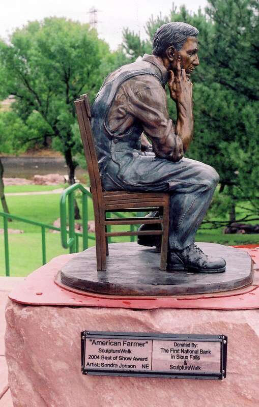 (1 in a multiple picture set)
American Farmer sculpture is just one of the many piecesof art in the park.  This statue caused me to contemplate the man.  I'm thinking he is done after a hard day's work, and is now wondering if the weather will