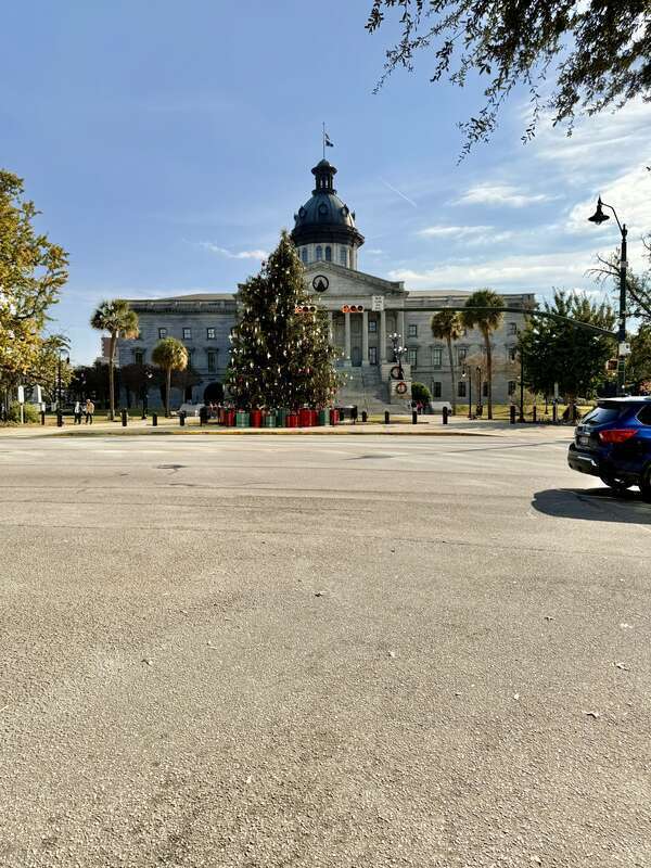 Built in 1851-1907, this Classical Revival-style building was designed by P. H. Hammarskold, John Niernsee, Frank McHenry Niernsee, Frank Pierce Milburn, and Charles Coker Wilson to serve as the state capitol building for South Carolina.  The