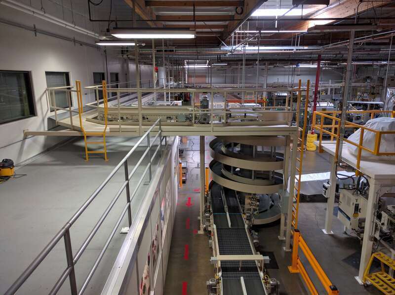 A spiral conveyor used to move items vertically, at the Jelly Belly factory.