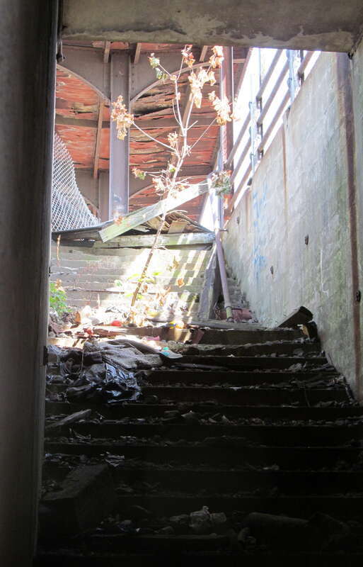 Closed-off stairs to the island platform at the former Lawrence station in August 2012