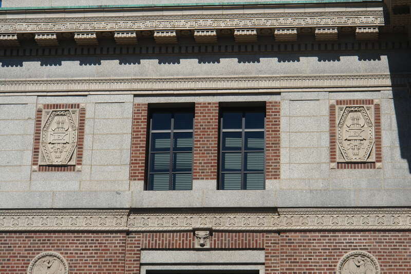Terra cotta panels decorate the cornice, frieze, and belt course.