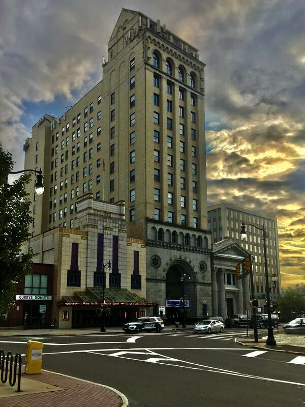 A September 2020 sunset view over the south side of Public Square in downtown Wilkes-Barre, Pennsylvania, comprising, from left to right: the F.M. Kirby Center for the Performing Arts (formerly the Comerford Theatre; built 1938), the Luzerne National