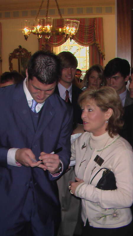 Local call number: PT11576
Title: Tim Tebow signing an autograph for Michelle Rehwinkel Vasilinda: Tallahassee, Florida
Date: March 4, 2009
General note: State Representative Vasilina, Democrat-Tallahassee, photographed with Tebow during a visit to