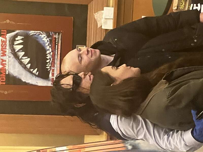 Tommy Wiseau selfieing with fans at the North Park Theater in Buffalo, screening The Room