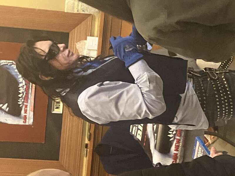 A sideways view of Tommy Wiseau at the North Park Theater screening of The Room