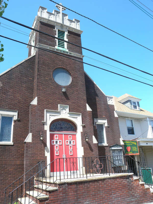Looking northwest from JFK Blvd at Trinity United Methodist Church on a sunny midday.