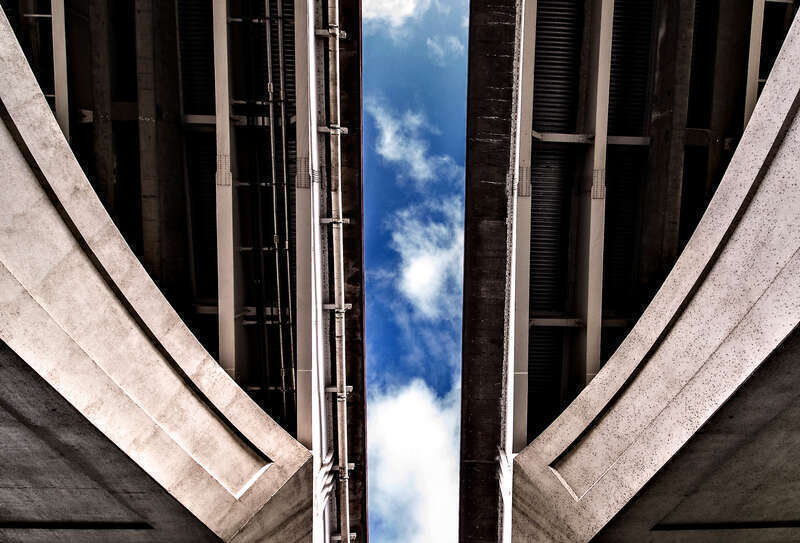 500px provided description: Another way to see the sky [#sky ,#blue ,#bridge ,#white ,#gray ,#cement]