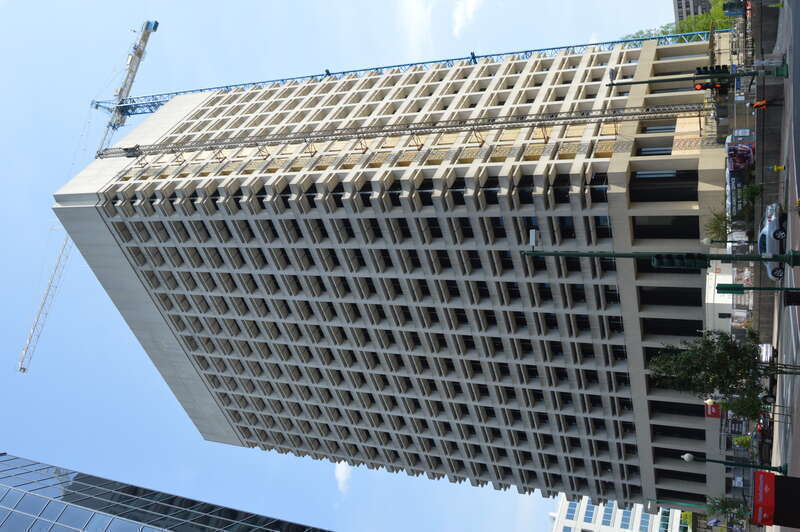 Front and northern side of the former Virginia National Bank Headquarters (in this picture, undergoing conversion to apartments), located at Main Street at Atlantic Street in downtown Norfolk, Virginia, United States.  Built in 1967, it is listed on