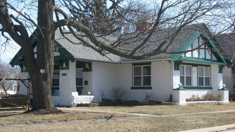 Front and western side of the Zion Chapter House of the American Women's League (now a private residence), located at 1300 Shiloh Boulevard in Zion, Illinois, United States.  Built in 1909, it is listed on the National Register of Historic Places.