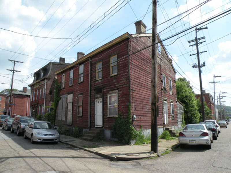 Picture of 184 38th Street (also known as McBride Log House) in the Lawrenceville neighborhood of Pittsburgh, Pennsylvania, on May 21, 2011.  The log house dates back to the 1820s, and was supposedly the oldest known log house that continued to be