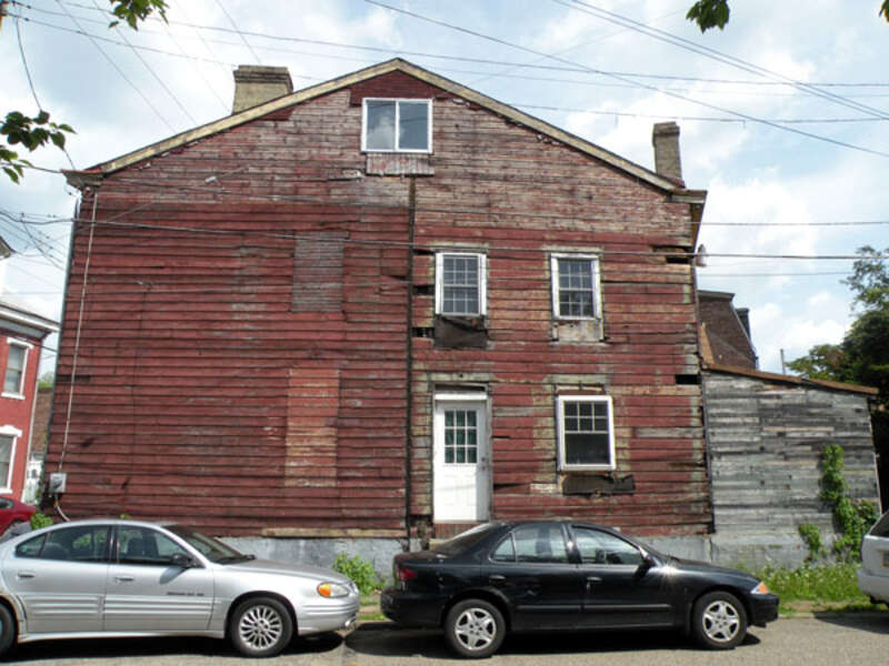 The side of 184 38th Street (also known as McBride Log House) in the Lawrenceville neighborhood of Pittsburgh, Pennsylvania, on May 21, 2011.  The log house dates back to the 1820s, and was supposedly the oldest known log house that continued to be