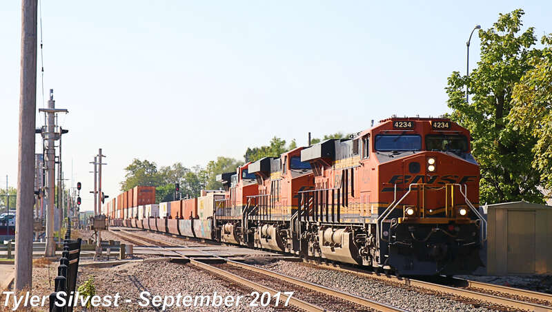 Burlington Northern Santa Fe 4234(ES44C4), 7341(ES44DC) and 970(C44-9W) Lead a Eastbound Intermodal on the Emporia Sub near the Santa Fe Street crossing west of Kansas Avenue in Olathe, KS.
Train: Q PHXCHI1 21
Video Link: 
Photo Taken: 9-23-17 at