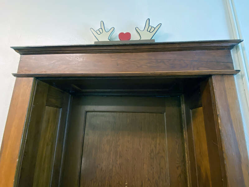 Doorway with signage,Charles Thompson Memorial Hall
1824 Marshall Ave, St Paul, MN
St Paul, Minnesota, USA.

Built in 1916, it was the first social club in the nation designed exclusively for the deaf.