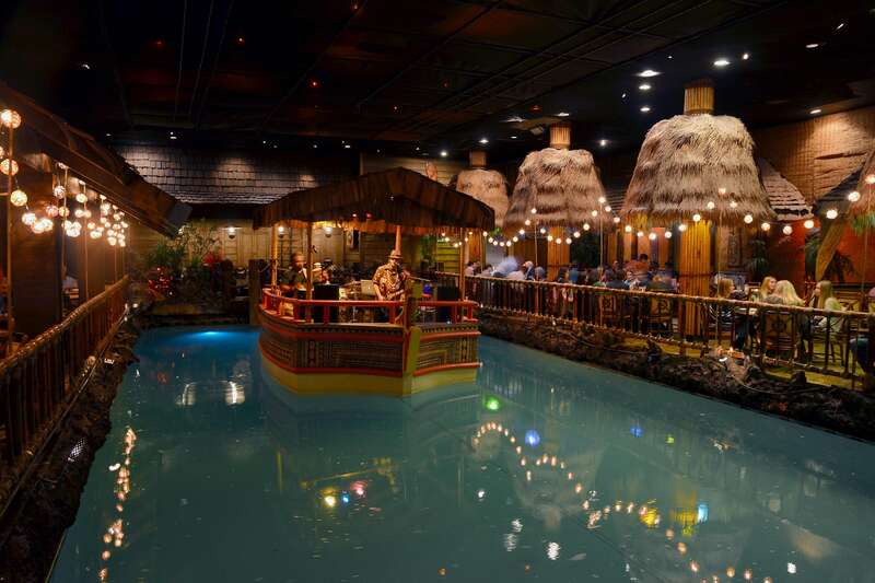 A boat with the band in the pool of the Tonga Room and Hurricane Bar.