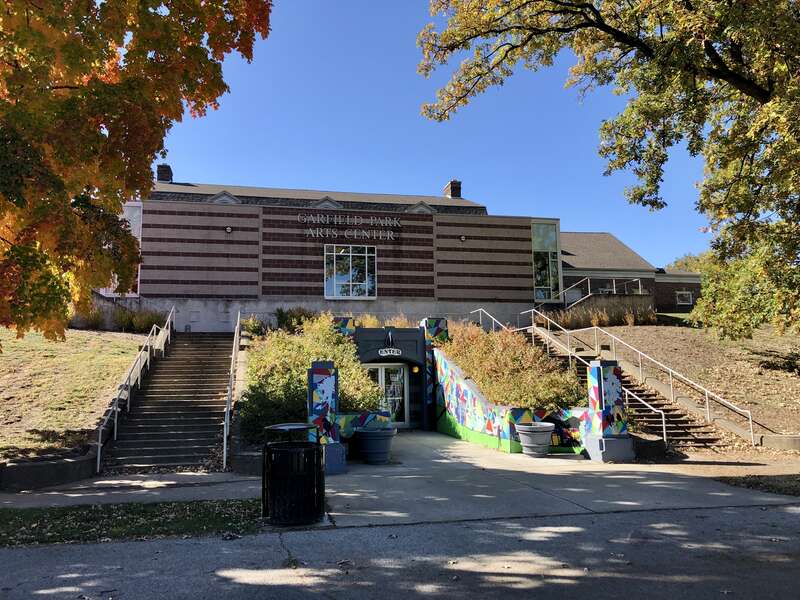 This image depicts the eastern exterior of the Garfield Park Arts Center at Garfield Park in Indianapolis, Indiana, U.S. It was built in 1922 and enlarged and renovated in 2006.