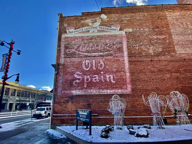As seen in January 2022, a well-preserved ghost sign on the north side of the building at 660 Main Street in downtown Buffalo, New York (now home to Shea's Smith Theater) identifies it as the onetime site of &quot;Buffalo's Leading Restaurant&quot;, Laube's