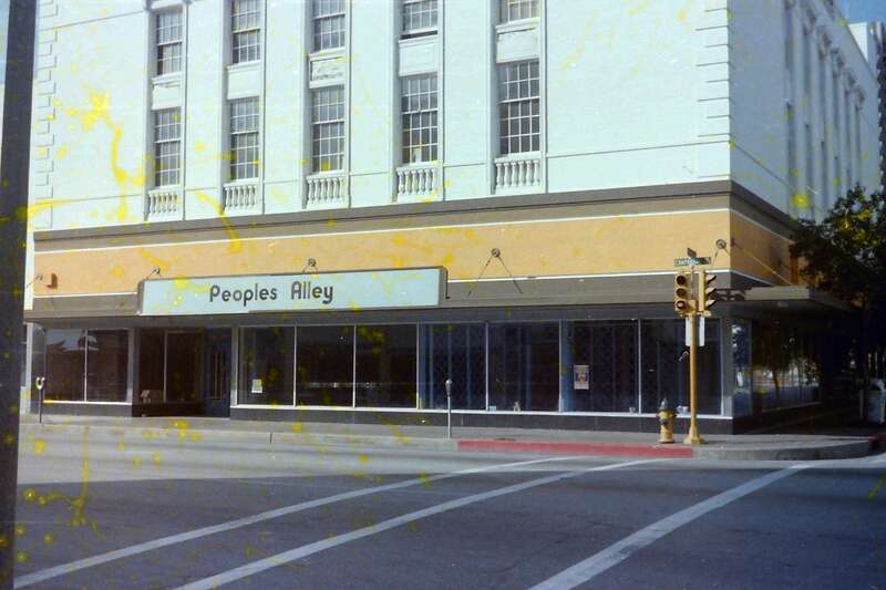 This was originally the Montgomery Ward building which closed in 1969. In the late 1970's, an effort was made to create an artistic community in this area called Peoples Alley.  A number of artists had studios and galleries here and, I think, in the