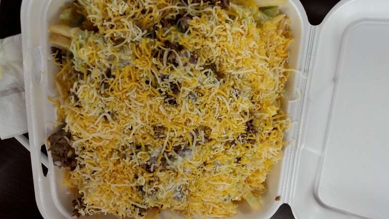 A full size order of Carne Asada Fries made at  Tacos El Gordo on Broadway in Chula Vista, California