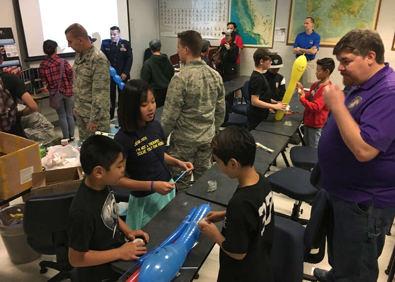 Students create balloon rockets with help from members of the Space and Missile Systems Center's Launch Enterprise Directorate during Onizuka Space Science Day 2017 at El Camino College in Torrance, Calif., March 11, 2017 (U.S. Air Force photo by