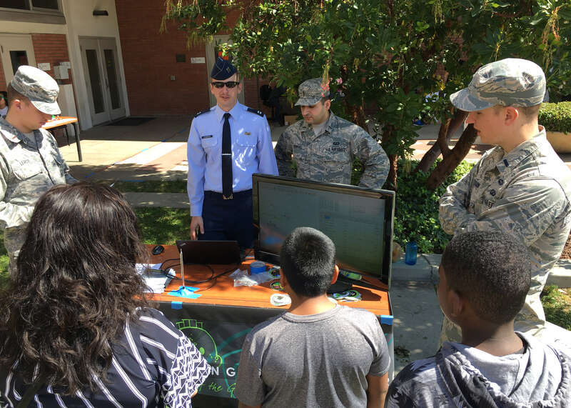 U.S. Air Force engineers from the Global Positioning Systems Directorate at Space and Missile Systems Center, demonstrate features of the electromagnetic spectrum using open source software and an antenna during Onizuka Space Science Day 2017 at El