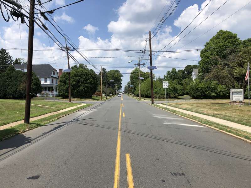 View north along Mercer County Route 579 (Grand Avenue) at New Avenue in Ewing Township, Mercer County, New Jersey