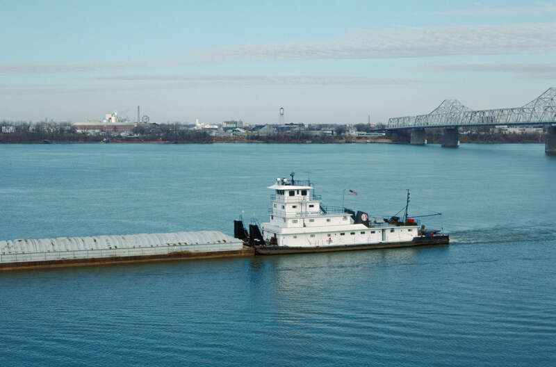 Looking NNE from Belvedere near 5th St..
Towboat &quot;Dakota Storm&quot; (doc. # 282986) downbound.
Clark Bridge at right.
Ohio River mile 604.
Louisville, Kentucky.
Dec. 1987.
File # 87l005.
.
This boat was built in 1960 by Marine Welding and Repair Works,