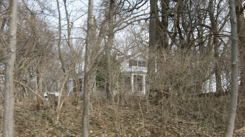 Roadside view of the Allison-Barrickman House, located at 6909 Wolf Pen Branch Road in Harrods Creek, Kentucky, United States.  Built in 1844, it is listed on the National Register of Historic Places.