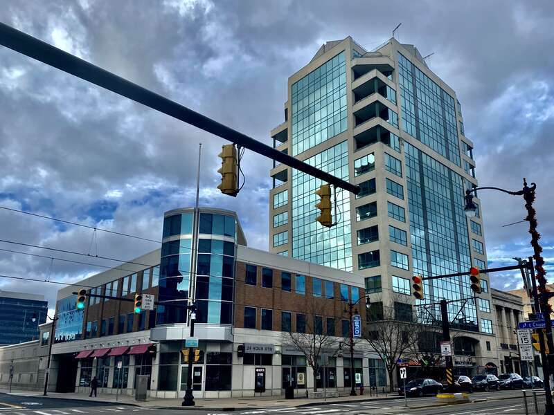 A view looking northwest from the corner of Main and East Chippewa Streets in downtown Buffalo, New York most prominently includes the City Centre Condominiums, at right. This 180-foot-tall, 14-story, postmodern-style mixed-use development was at the
