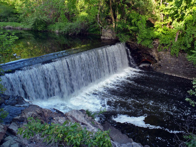 The Flock Process Dam Removal project in Norwalk, Connecticut removes the first dam on the Norwalk River, eliminating dam failure risk, allowing fish to move freely between salt and freshwater, facilitating sediment transport and building natural