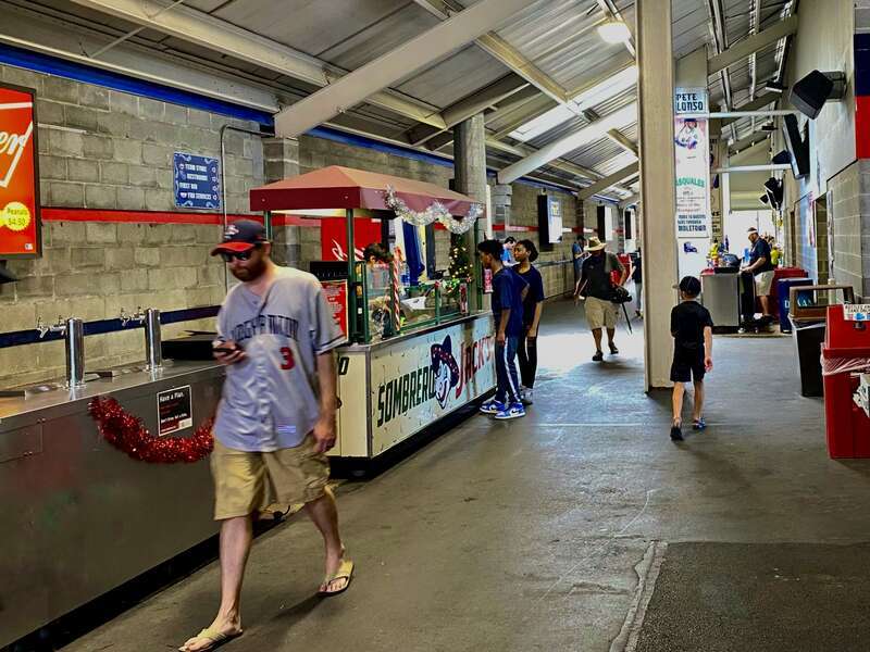 Sausage sandwiches, nachos, and other concessions are offered for sale in the concourse of Mirabito Stadium in Binghamton, New York, as seen during a game between the hometown Rumble Ponies and the visiting Hartford Yard Goats. Somewhat incongruously