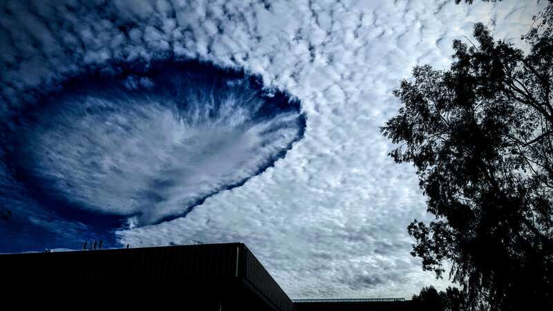 This is an example of a hole (cloud phenomenon) forming when the temperature of H2O in the clouds is below freezing, but the H2O, dd not freeze.