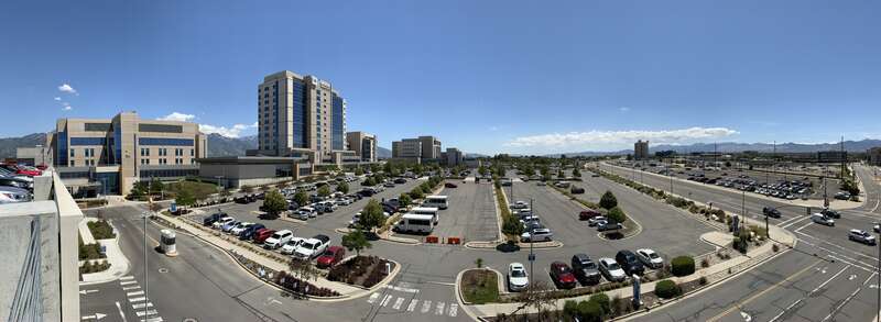 Panorama of the Intermountain Medical Center campus, with main parking lot in view.
