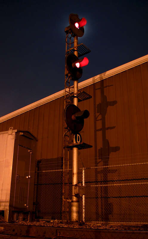 The moon hides behind a stop indication at market street.