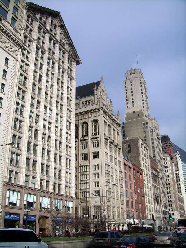 Looking North along Michigan Avenue.  The Monroe Building designed by Holabird &amp;amp; Roche 1912, The University Club also by Holabird &amp;amp; Roche 1908.