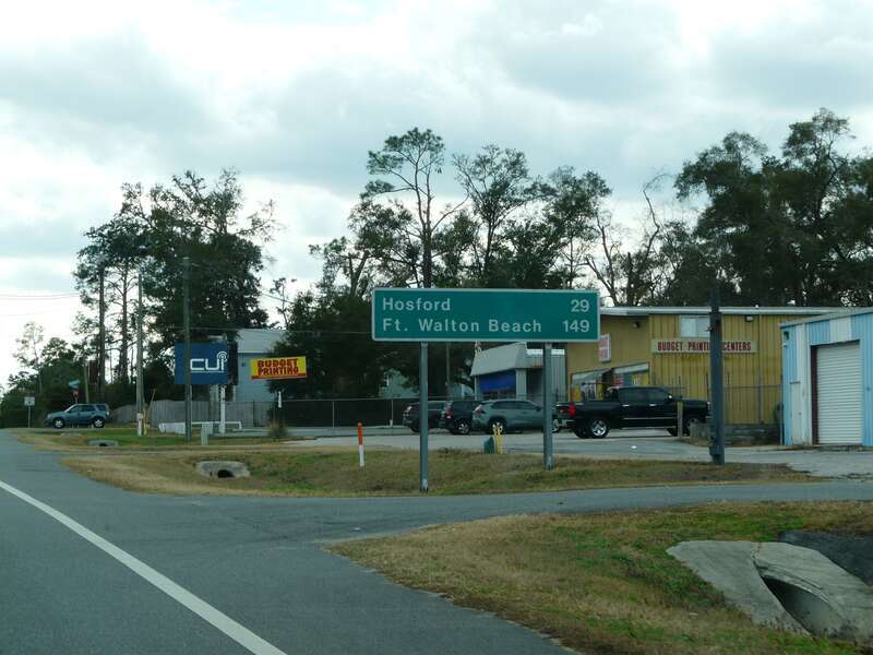 Mileage sign on westbound Florida State Road 20 (Blountstown Street) just outside of Tallahassee, Florida.