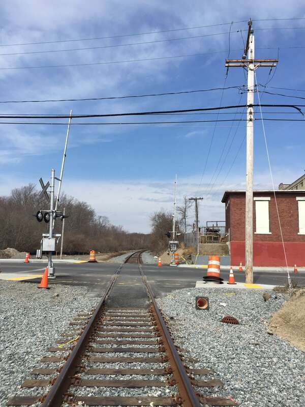 The upgraded Nash Road grade crossing in New Bedford seen from the railroad tracks in March 2016. Automatic gates and flashers and a new crossing surface were installed.