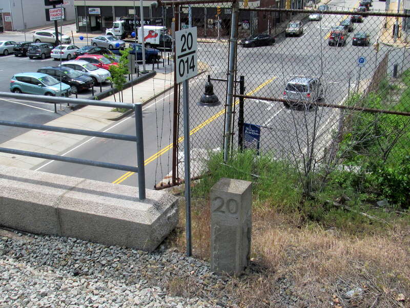 Old and new mile markers at Brockton station in June 2017