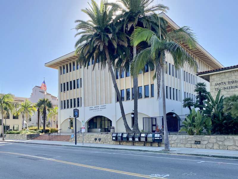 Built in 1965-1966, this Modern New Formalist-style building was constructed to serve as an office building for Santa Barbara County, supplementing the old Santa Barbara County Courthouse.  The building features a Miesian curtain wall with
