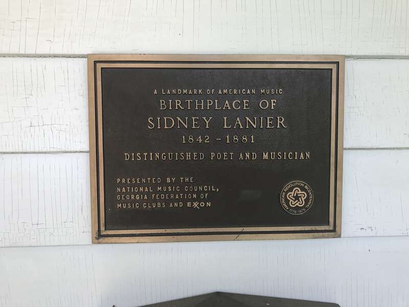 Historical sign on the entry way of Sidney Lanier Cottage explaining it is the birthplace of Sidney Lanier.