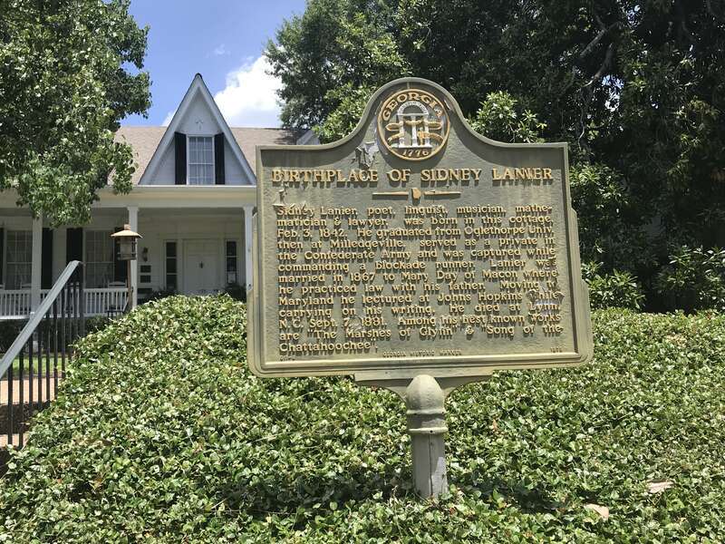 The Georgia History sign posted in the courtyard of Sidney Lanier Cottage.