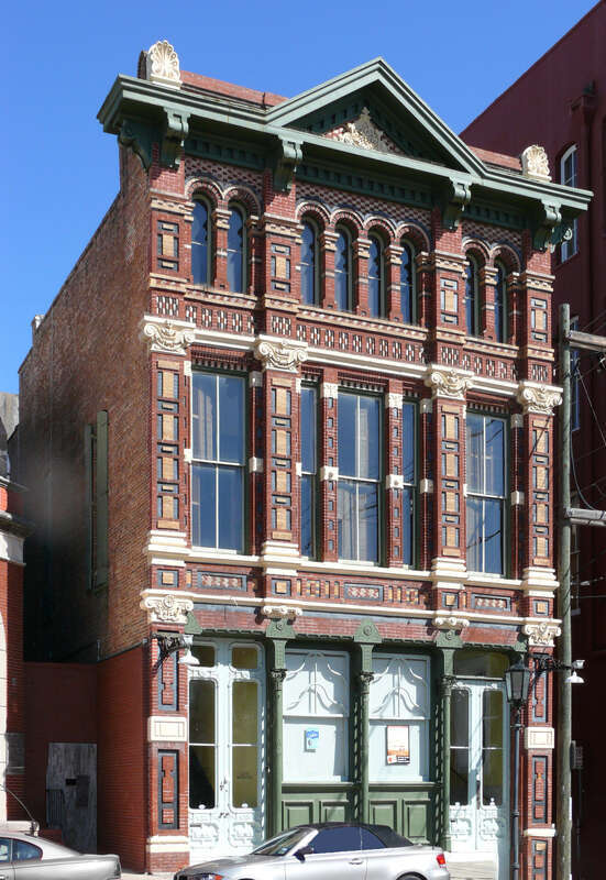 Designed in neo-renaissance, high Victorian style by Nicholas J. Clayton, noted architect, for H. M. Trueheart &amp;amp; Co., first chartered realty firm in Texas, founded by John O. Trueheart in 1857. H. M. Trueheart joined his father in 1866, admitted