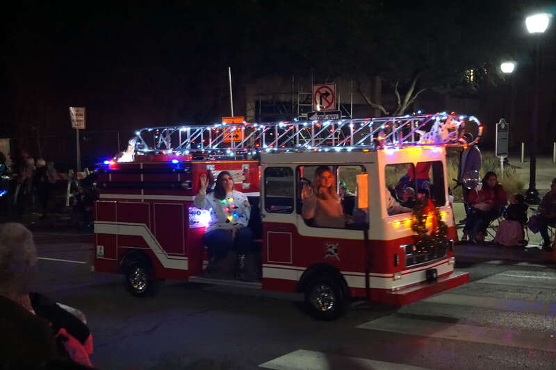 A miniature fire engine in the 2019 Arlington Holiday Lights Parade in Arlington, Texas (United States).