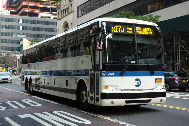 An East Midtown–57th Street-bound X17J express bus traveling east on 34th Street between 8th and 9th Avenues in the Garment District, Midtown Manhattan. This branch of the X17 has since been replaced by the SIM8.