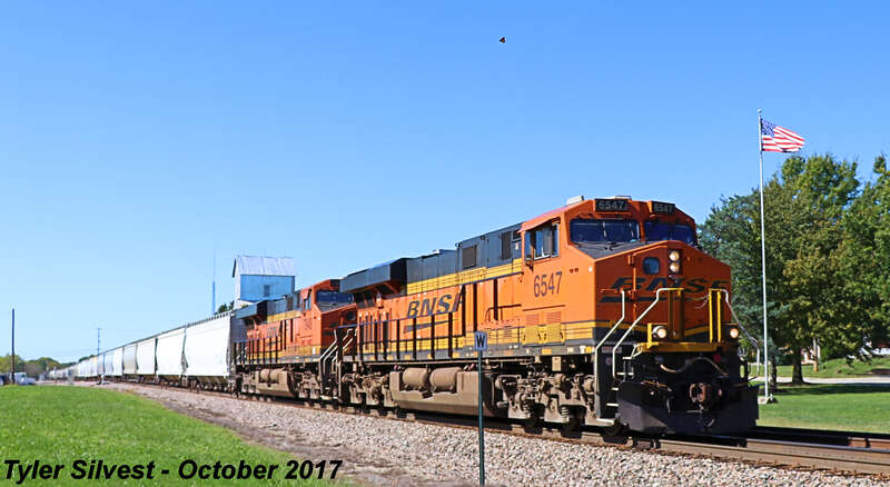 Burlington Northern Santa Fe 6547(ES44C4) and 7848(ES44DC) Lead a Northbound Manifest on the BNSF Fort Scott Sub at the Noland Road Crossing south of Santa Fe Trail Drive in Lenexa, Kansas.
Train: H TULGAL1 07
Video Link: 
Photo Taken: 10-8-17 at