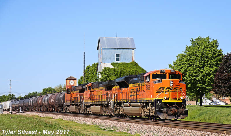 Burlington Northern Santa Fe 8463(SD70ACe), 5076(C44-9W) and 3932(ET44C4) Lead a Northbound Manifest on the BNSF Fort Scott Sub after passing the Depot before the Noland Road Crossing south of Santa Fe Trail Drive in Lenexa, Kansas.
Video Link: