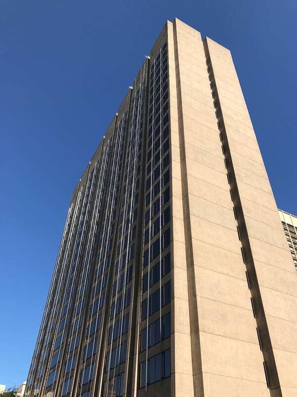Building at W Baltimore Street, corner Hopkins Place, Baltimore. Photograph by Eli Pousson, 2017 June 28.