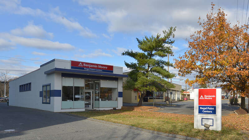 A small, one story building that houses Benjamin Moore Regal Paint Centers. 500 Hungerford Drive, Rockville, Maryland 20850.
