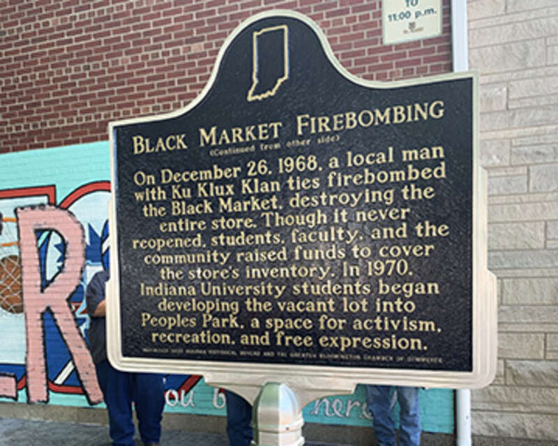 Side two of the Black Market Firebombing historical marker in Bloomington, Monroe County, Indiana.