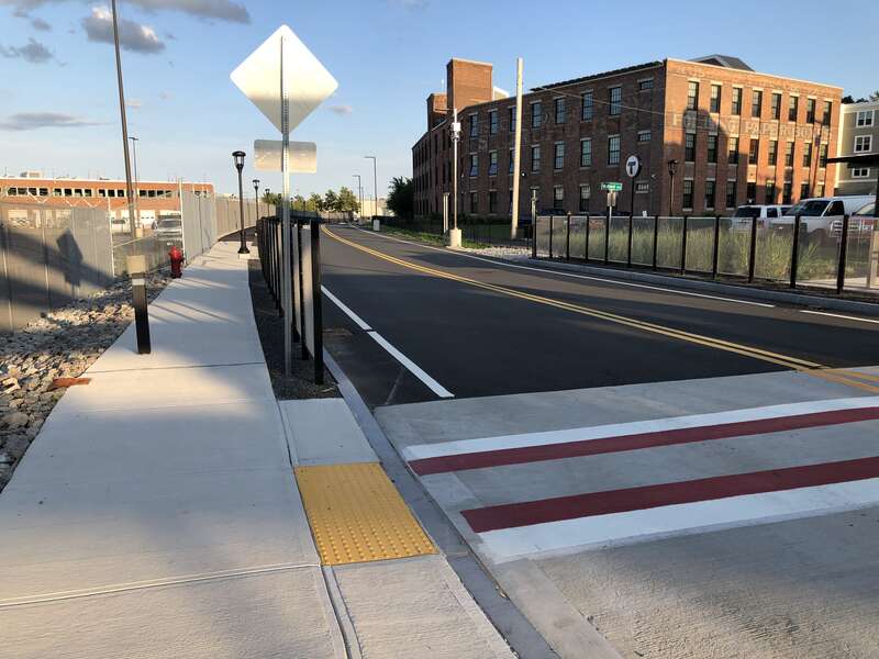 SL3 ROW looking east from the Box District station, MBTA SL3 line. Crosswalk connects outbound and inbound platforms. The path at left leads to Griffin Way.