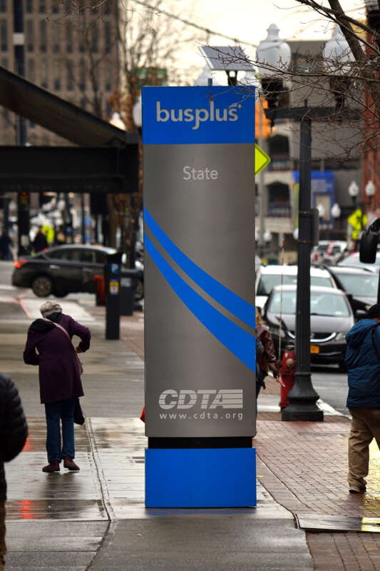 The Busplus blue line sign at the State St. stop